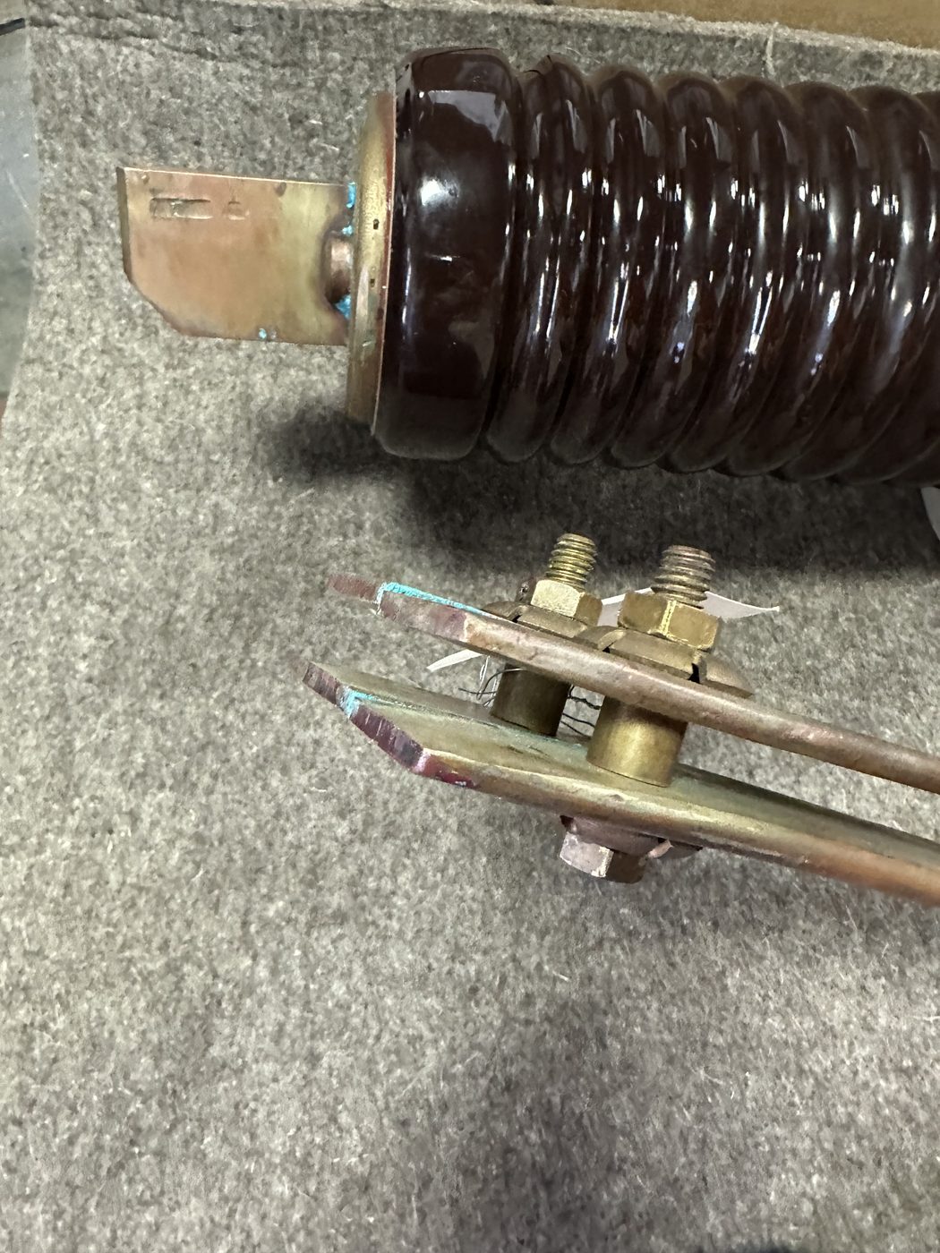 Utility distribution disconnect switch as received at Southern Switch, full assembly with porcelain insulator, blade arm, and visible corrosion and wear on contact surfaces.