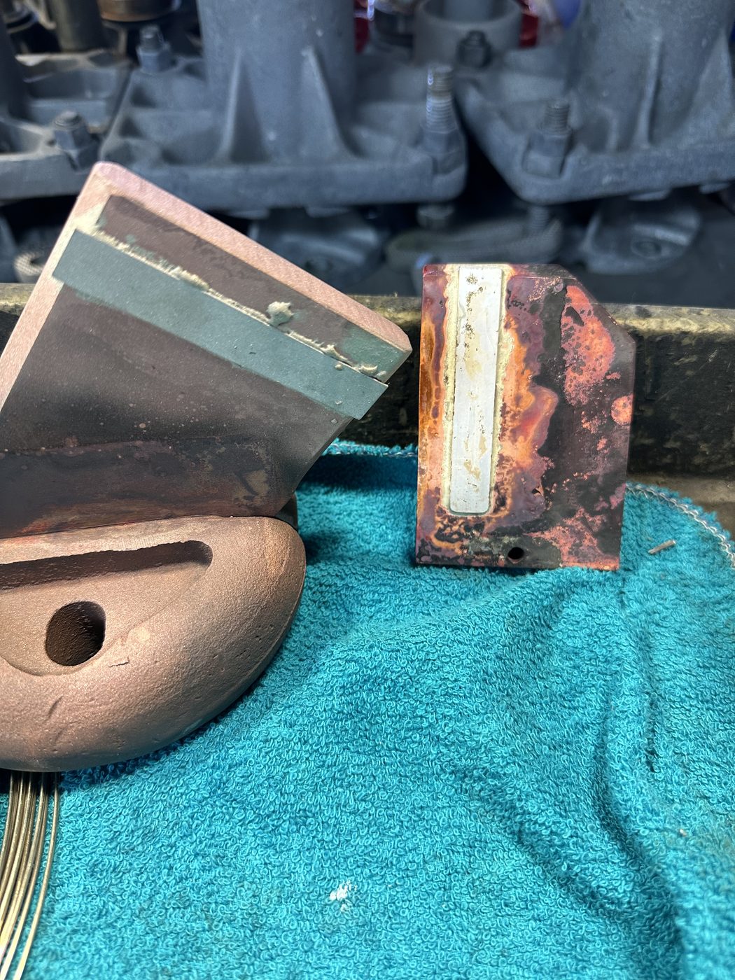 Side-by-side comparison at Southern Switch, original corroded utility disconnect contact (top) versus the new machined copper replacement contact with silver insert (bottom).