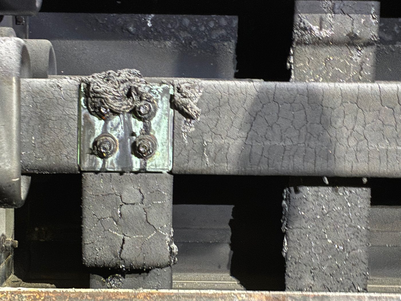 Second view of the burnt bus and damaged insulation in the Duke Crystal River cubicle before restoration.