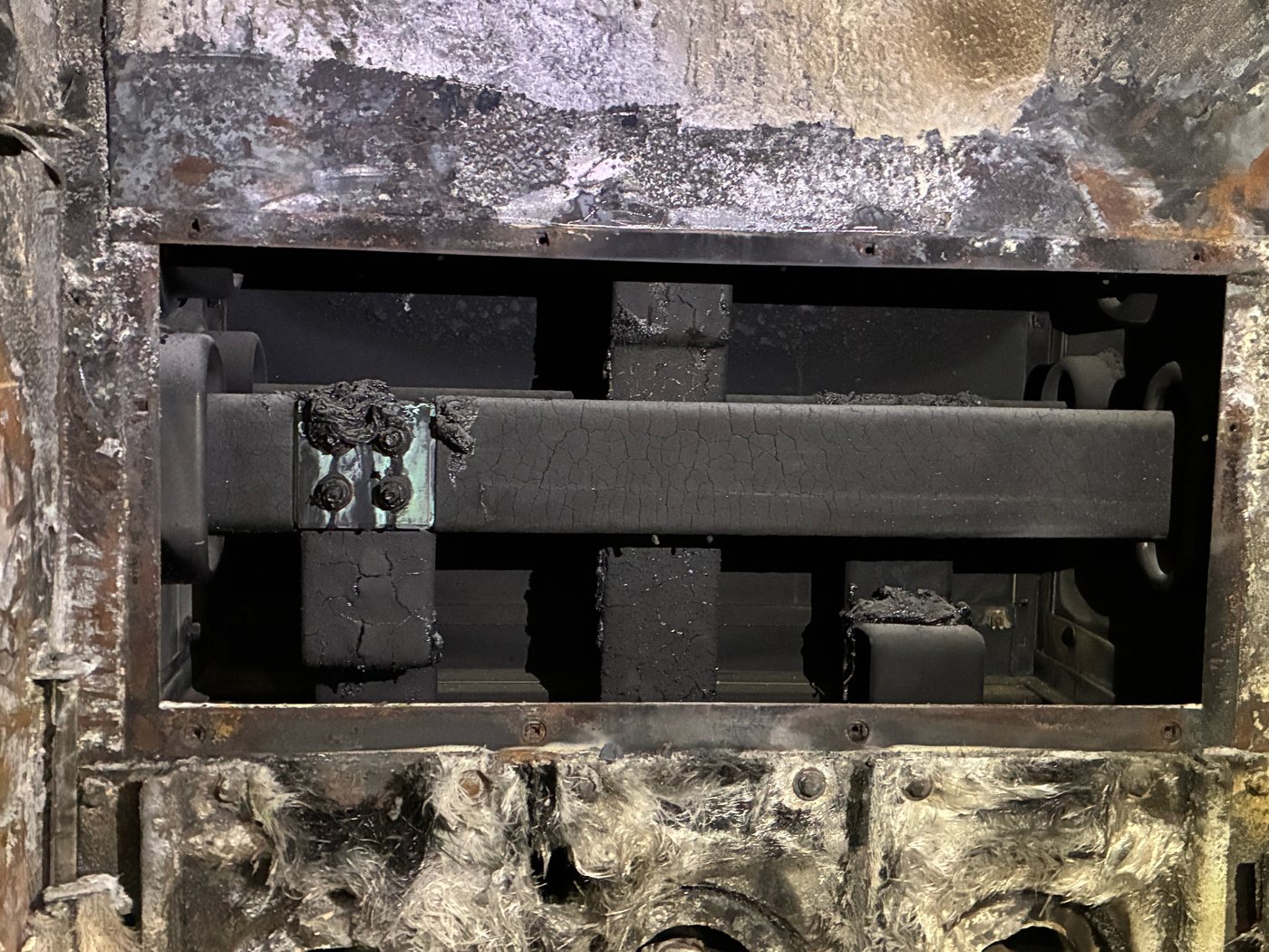 Burnt bus and charred insulation in the fire-damaged Duke Crystal River breaker cubicle.