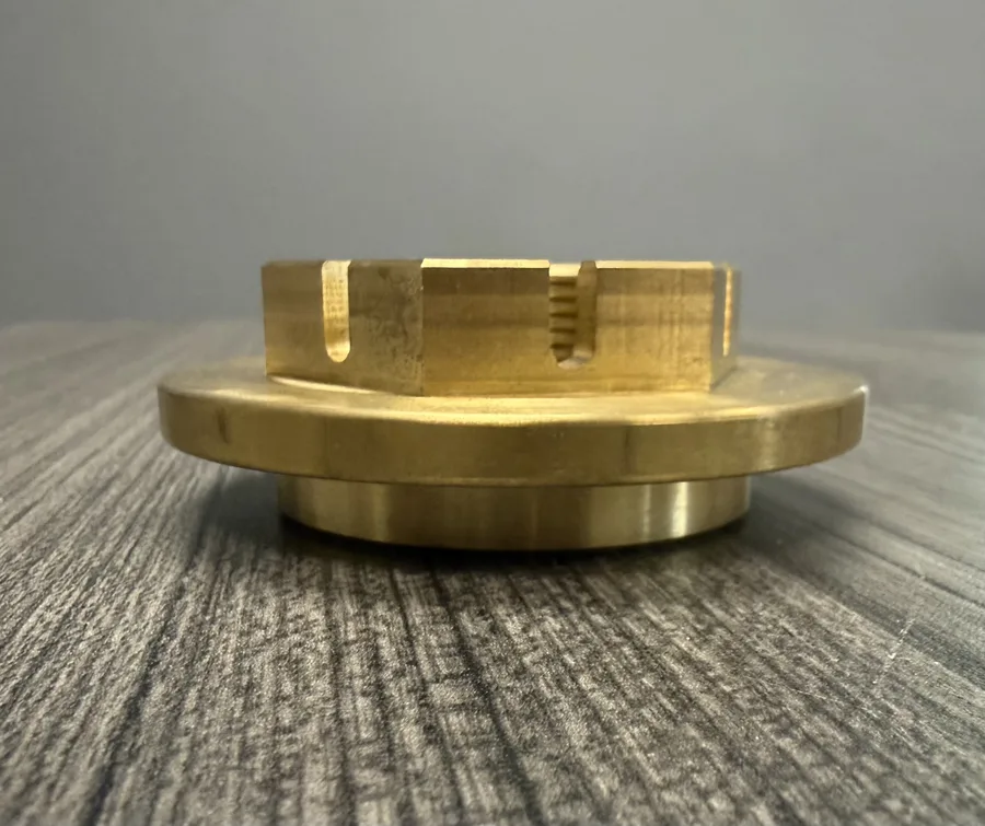 Machined brass castellated lock nut for the SSC EV2 bearing rebuild, wide flange matches the bearing tube OD