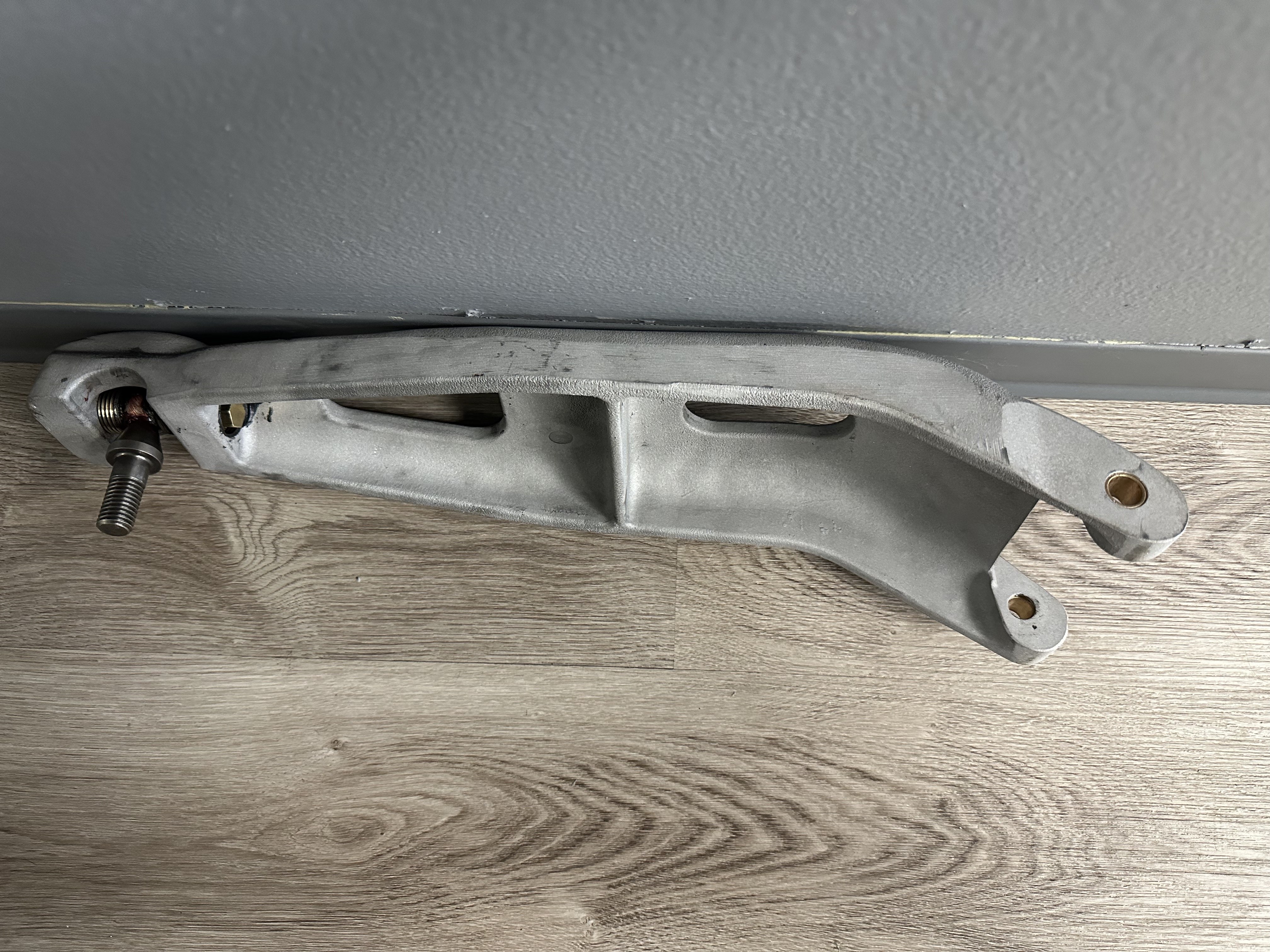 Rebuilt Southern States EV2 linkage arm, aluminum casting with stainless ball joint stud, brass hex nut, and brass bushings pressed into the pivot bores