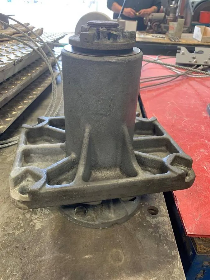 Example 230 kV bearing: steel housing, steel shaft, and an aluminum lock nut. Aluminum against steel corrodes and seizes the assembly in place.