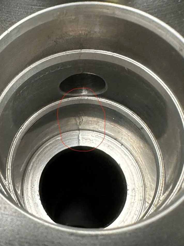 A crack was discovered in the manifold bore (circled). A new manifold was fabricated by Southern Switch & Contacts.