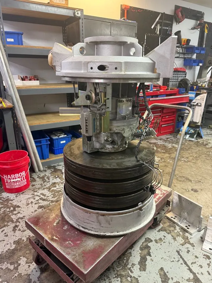 The resealed mechanism reassembled and on test, hydraulics held pressurized for 24 hours to confirm every seal is tight.