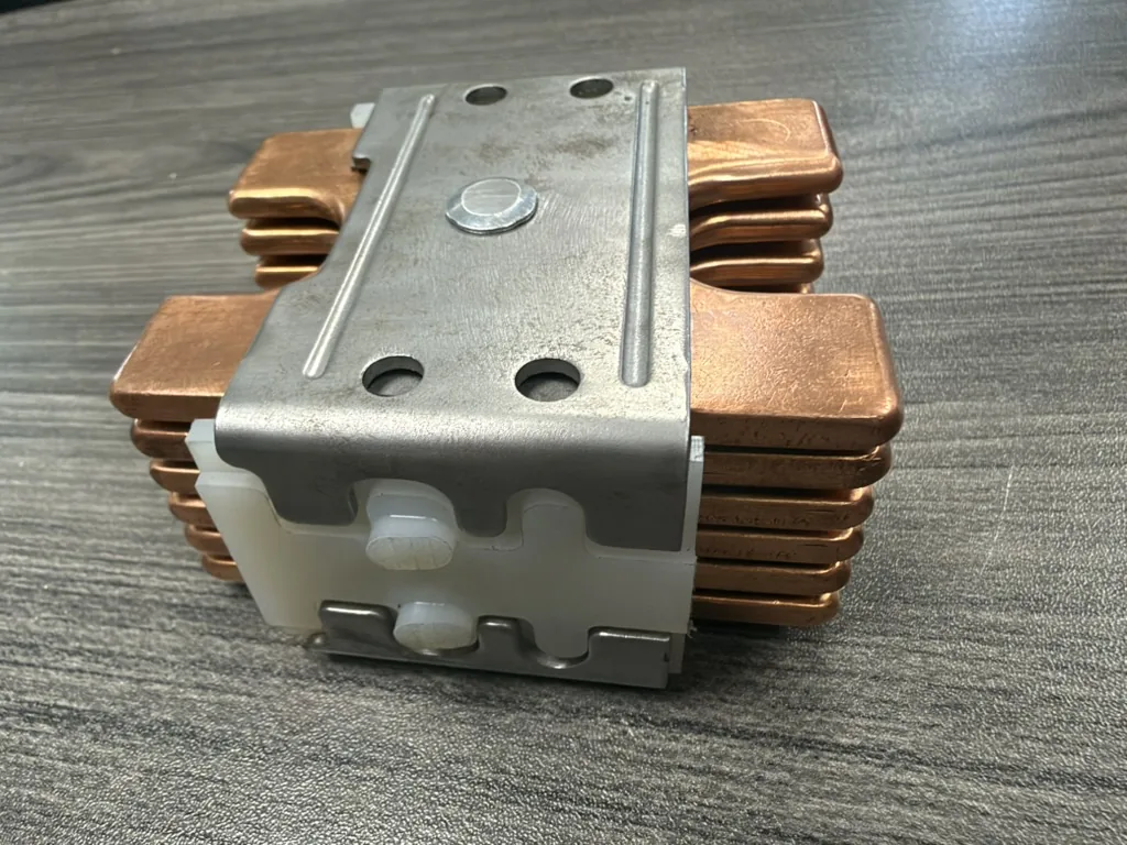 Reinhausen RMV-II reversing switch moving contact assembly, top view showing the aluminum bracket and insulator block