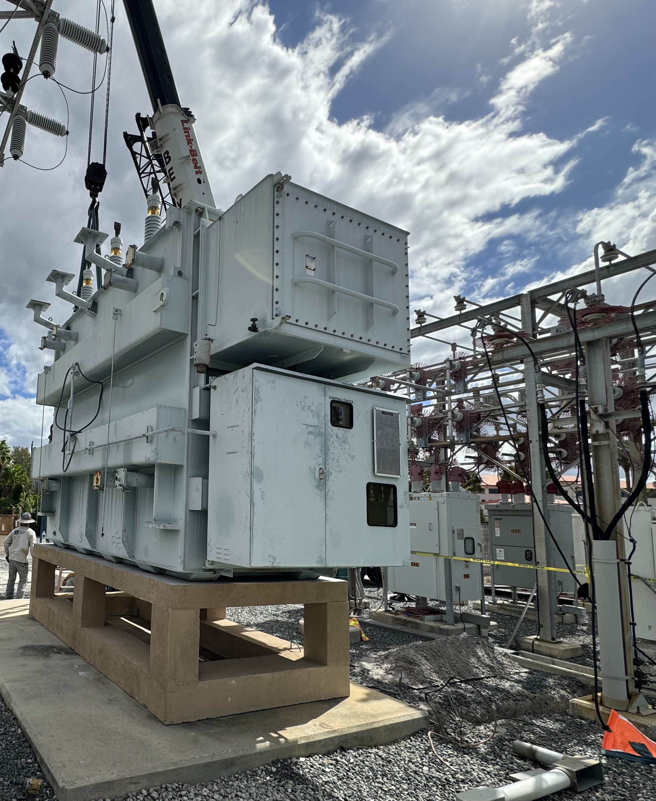 TECO power transformer being crane-set onto an elevated concrete platform at a MacDill AFB area substation, 2023. Southern Switch coordinated the heavy lift and performed apparatus testing.