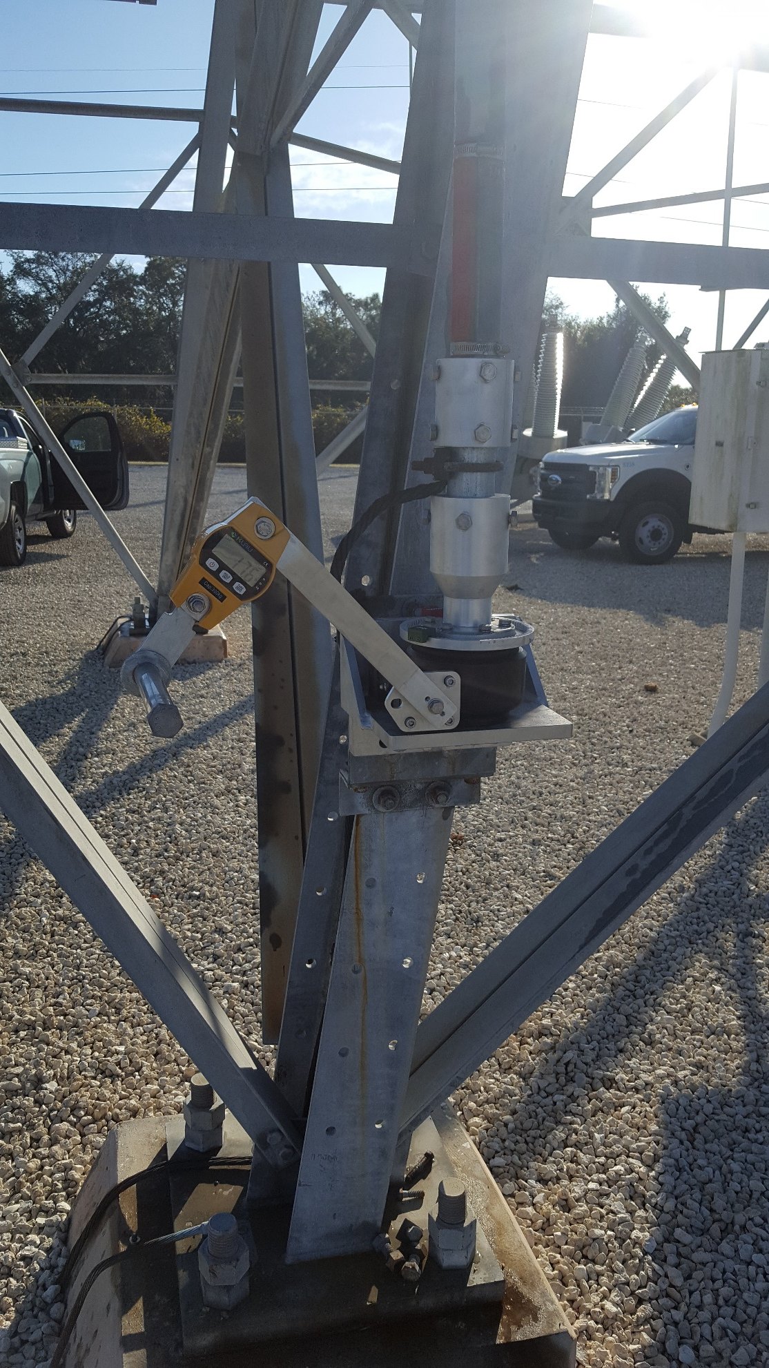 Klau Model OCS-L digital crane scale attached to the UGOR crank arm for force measurement testing at a substation