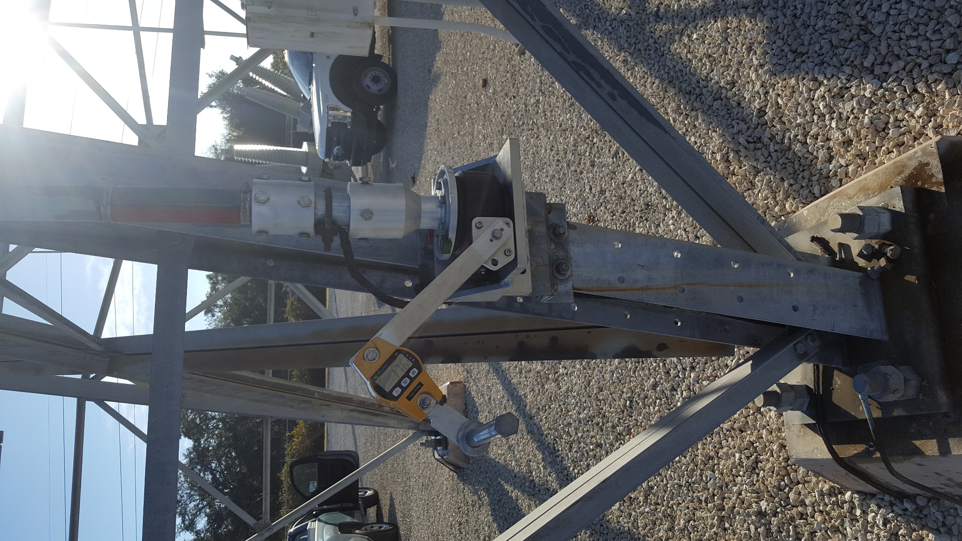 Klau Model OCS-L digital crane scale attached to the UGOR crank arm for force measurement testing at a substation