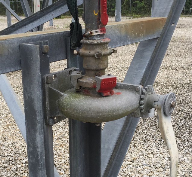 UGOR installed on a gang-operated switch at a substation, showing the red closed stop, crank handle, and downpipe adapter